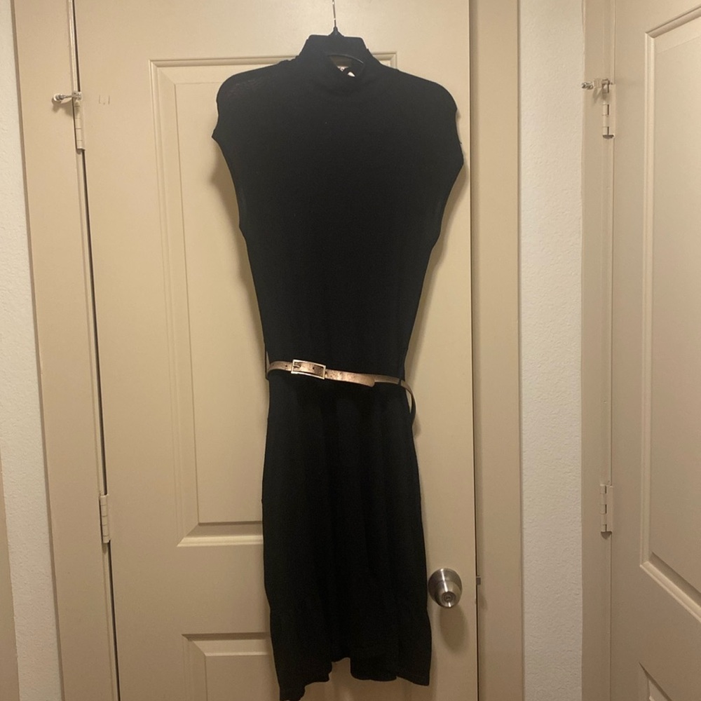 Very thin sweater like cute little black dress.  Belt is worn!